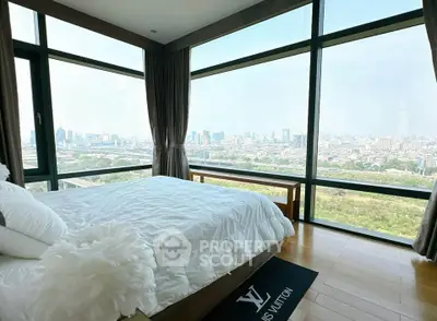 Luxurious bedroom with panoramic city view and elegant decor