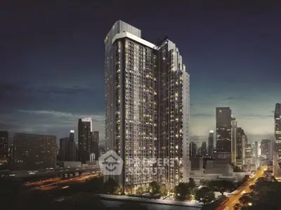 Stunning night view of a modern high-rise building in a vibrant cityscape.