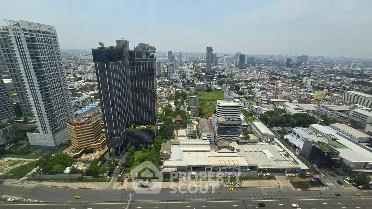 Stunning cityscape view from high-rise building showcasing urban skyline and modern architecture.