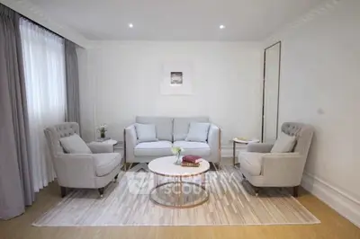 Elegant living room with plush seating and modern decor, perfect for relaxation and entertaining.