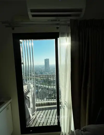 Stunning high-rise apartment balcony with panoramic city view and modern air conditioning unit.