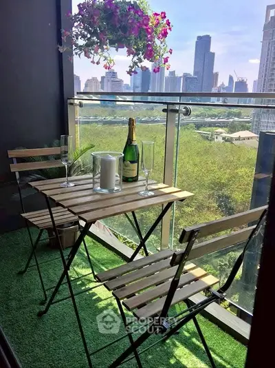 Charming balcony with city view, perfect for relaxing with a drink and enjoying the skyline.