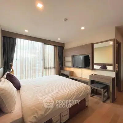 Spacious modern bedroom with large window and stylish decor in luxury apartment.