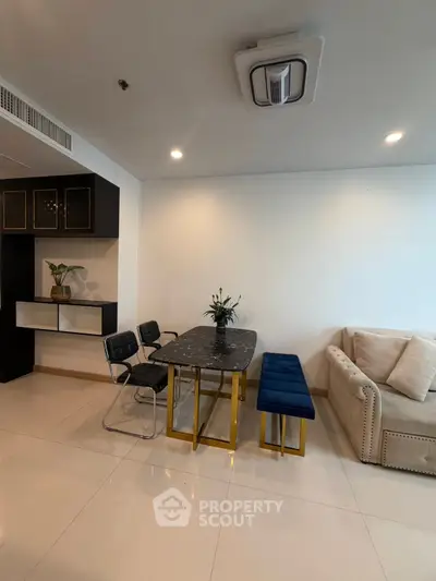 Modern living room with elegant dining area and stylish furniture