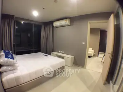 Modern bedroom with air conditioning and sleek design in a contemporary apartment.