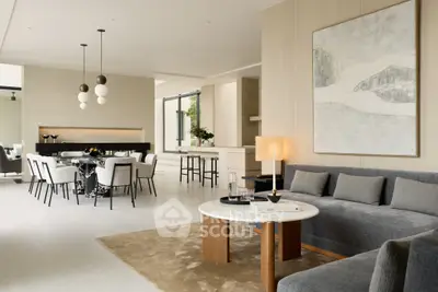 Luxurious open-plan living and dining area with modern decor and elegant lighting.