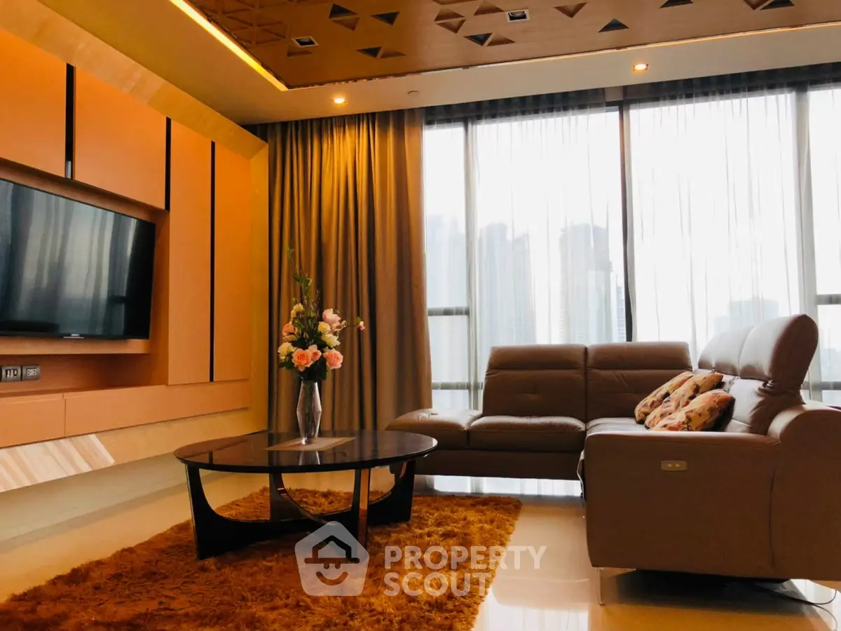 Luxurious living room with modern design and city view, featuring plush sofa and elegant decor.