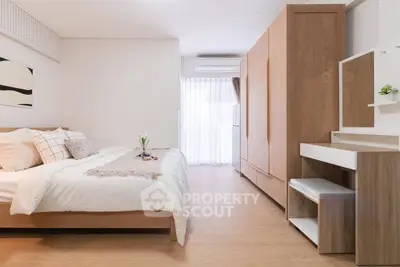Spacious modern bedroom with wooden furniture and natural light