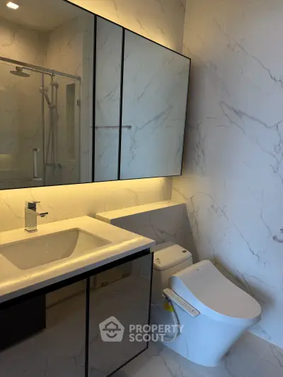 Modern bathroom with sleek fixtures and elegant marble tiles