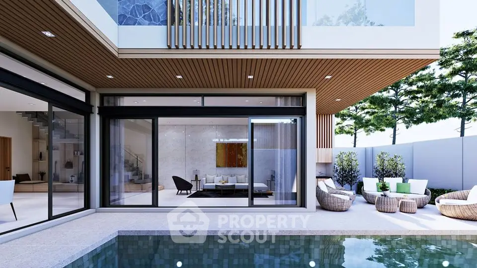 Luxurious modern home with pool and stylish outdoor seating area.