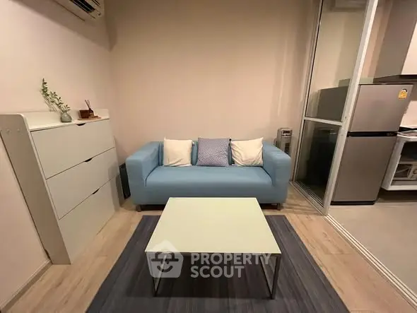 Cozy living room with blue sofa and modern decor