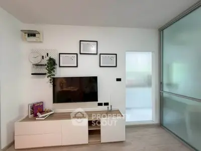 Modern living room with sleek TV unit and minimalist decor