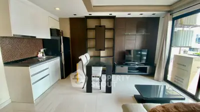 Modern open-layout living room with sleek kitchen and stylish decor