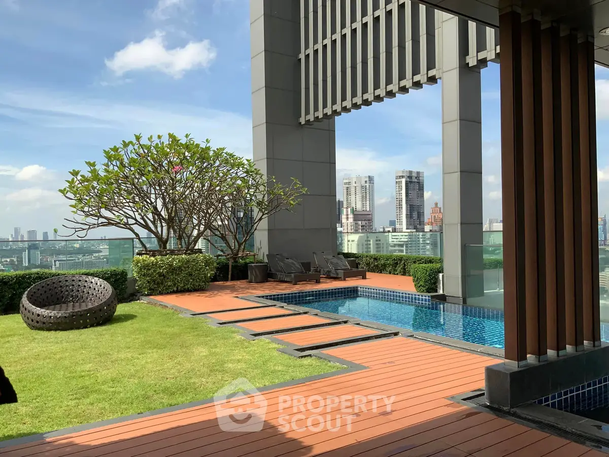 Luxurious rooftop pool with stunning city view and lush greenery