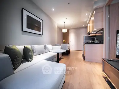 Modern living room with open kitchen layout and stylish decor