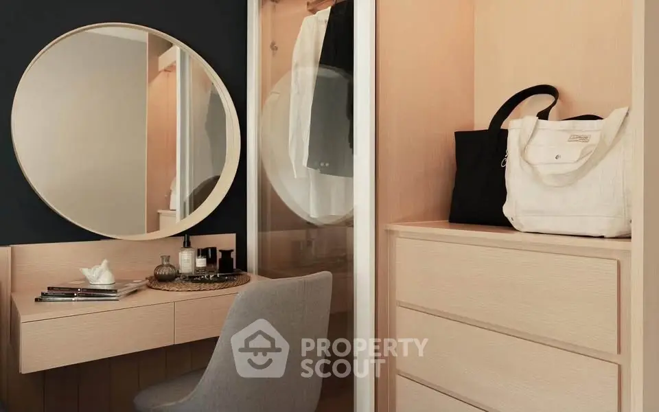 Stylish modern dressing area with round mirror and elegant storage solutions.