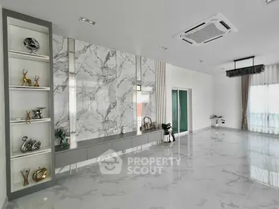 Luxurious modern living room with marble accents and elegant decor