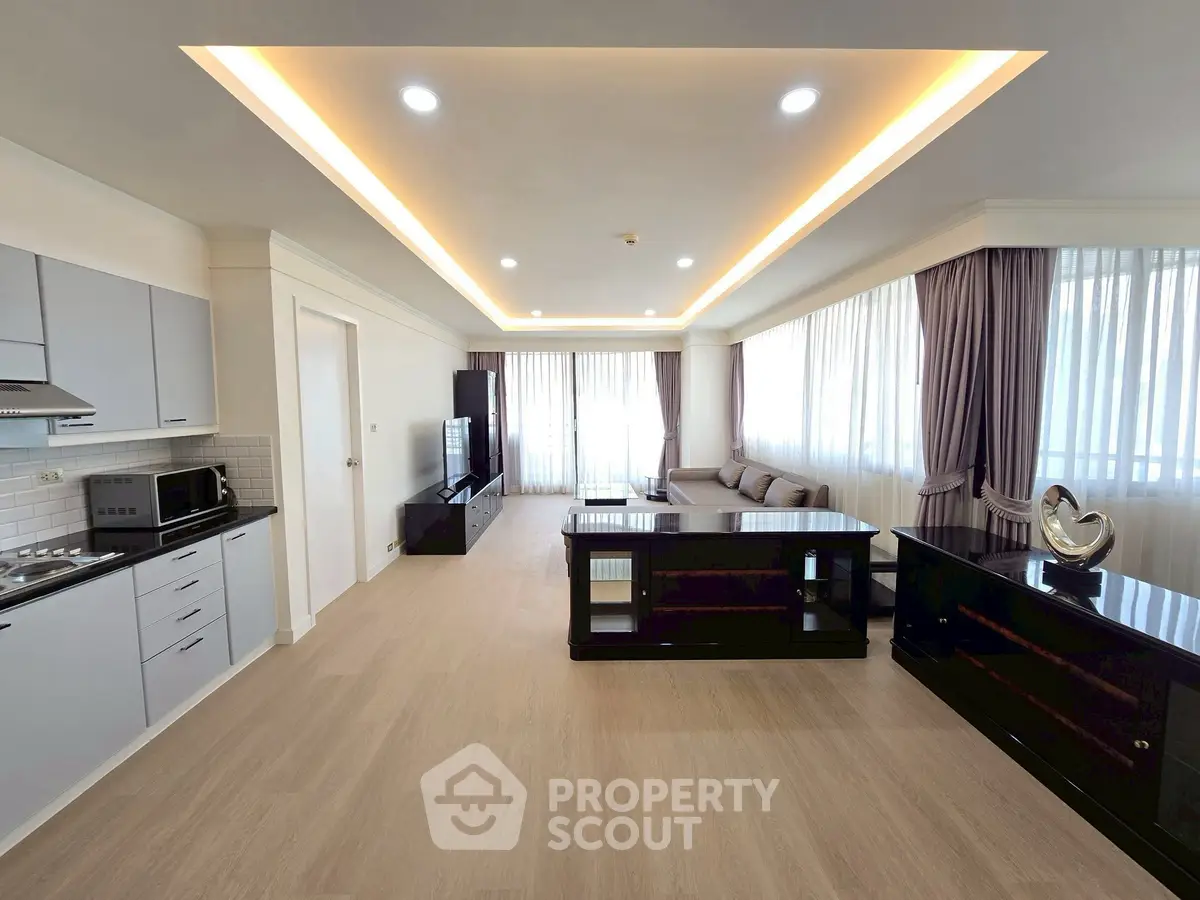 Spacious modern living room with open kitchen and elegant decor