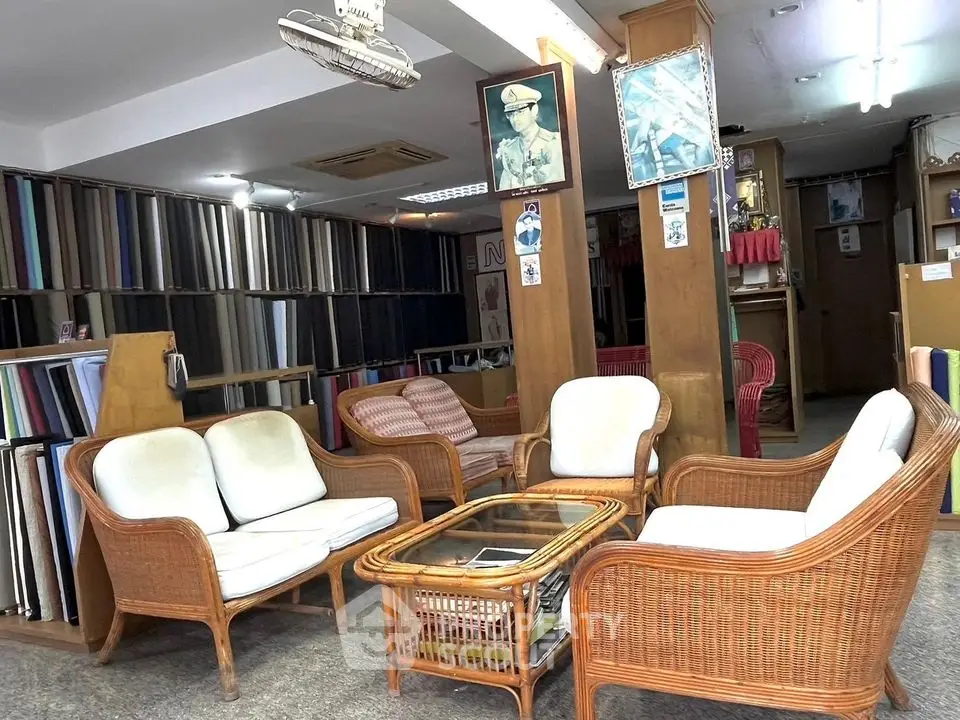 Spacious living room with wicker furniture and cozy seating area