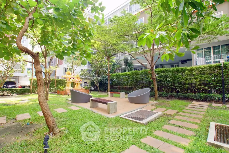 Beautiful garden area with modern seating in a residential complex