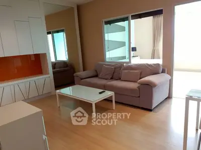 Modern living room with stylish furniture and large mirror