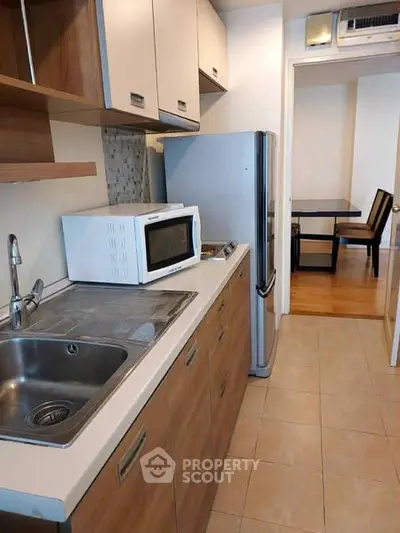 Modern kitchen with sleek cabinetry and stainless steel appliances