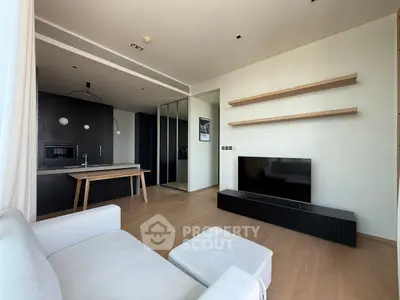 Modern living room with sleek kitchen and stylish decor