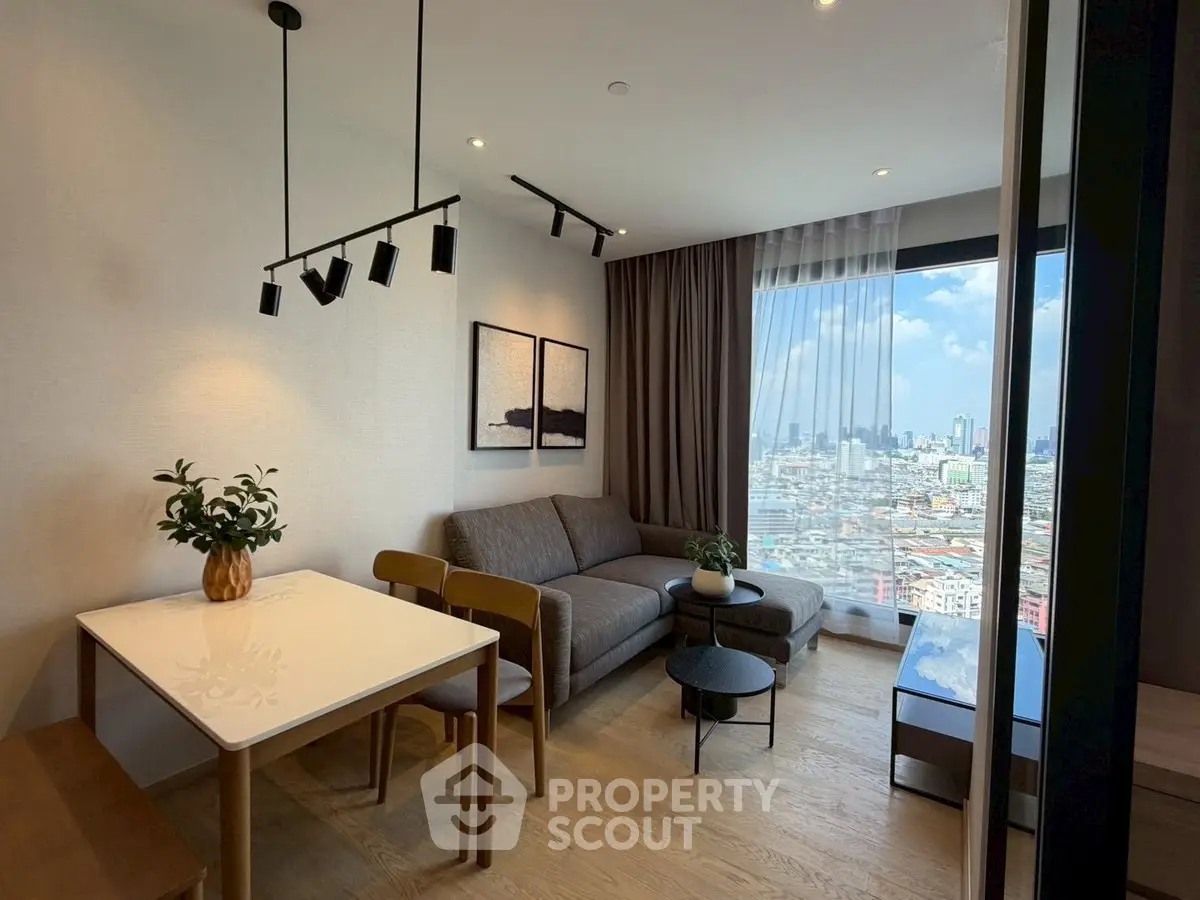 Modern living room with city view, stylish furniture, and elegant decor