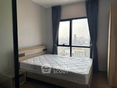 Modern bedroom with large window offering stunning city views, featuring a comfortable bed and stylish decor.