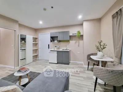 Modern open-layout living room with stylish kitchen and cozy dining area
