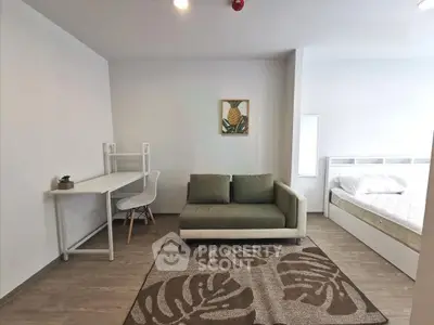 Modern studio apartment with cozy living area and stylish decor