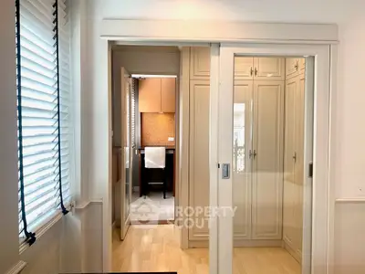 Stylish interior with sliding doors and ample storage in a modern home.