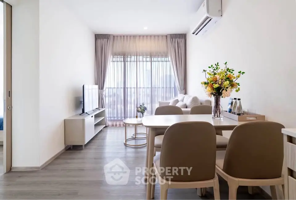 Modern living room with elegant dining area and large window view