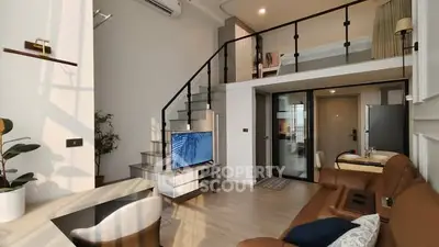 Modern loft-style living room with mezzanine and stylish decor