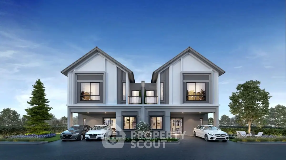 Modern duplex house with sleek design and luxury cars in driveway