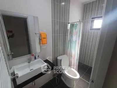 Modern bathroom with sleek fixtures and stylish tile design