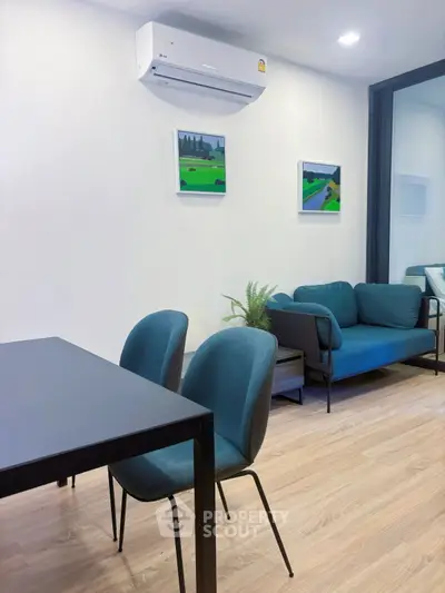 Modern living room with sleek furniture and air conditioning, perfect for comfortable urban living.