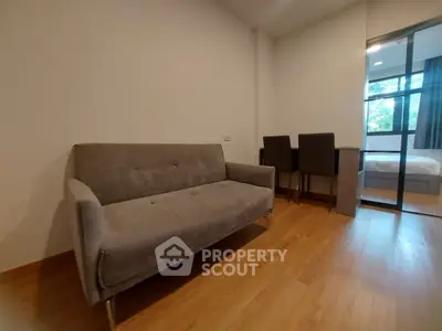 Modern apartment interior with cozy sofa and wooden flooring