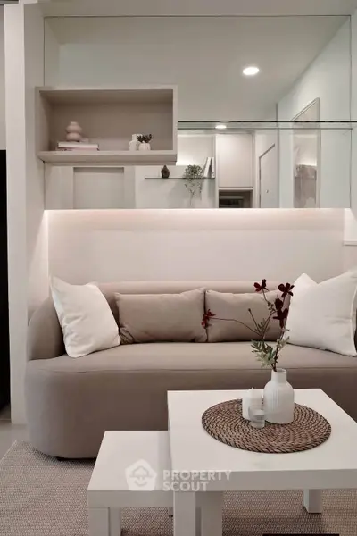 Modern living room with stylish beige sofa and elegant decor