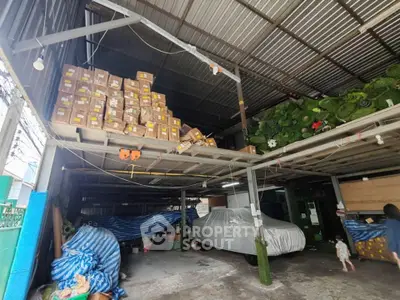 Spacious warehouse with ample storage and covered parking area