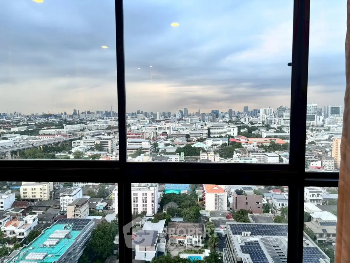 Stunning cityscape view from a high-rise window, showcasing urban skyline and vibrant city life.