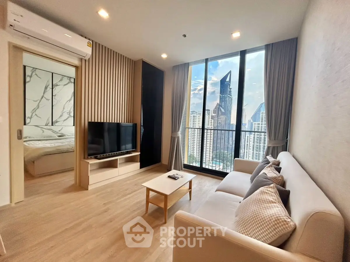 Modern living room with city view and stylish decor in high-rise apartment