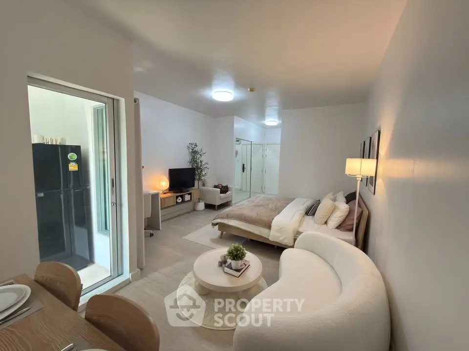 Modern studio apartment with cozy living area and stylish decor