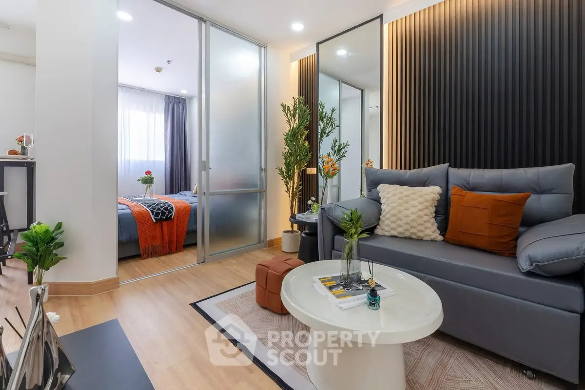 Modern living room with stylish decor and cozy bedroom view