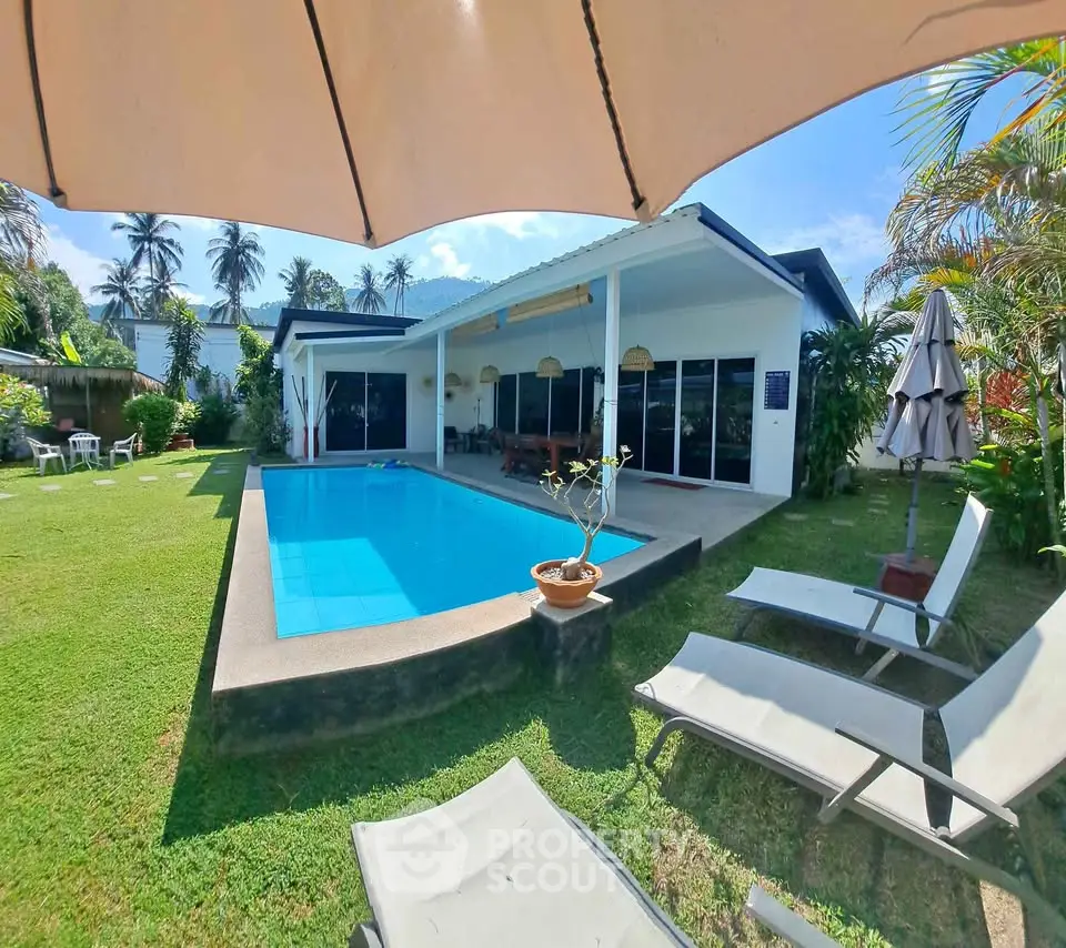 Stunning villa with private pool and lush garden, perfect for tropical living.