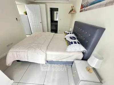 Modern bedroom with stylish bed and elegant decor in a cozy apartment.