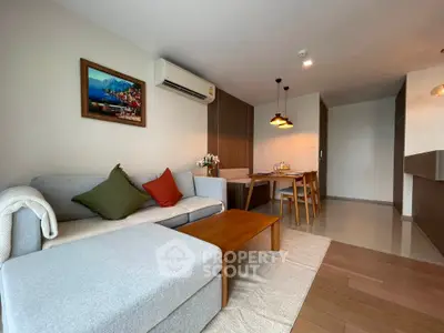Spacious modern living room with cozy dining area and stylish decor