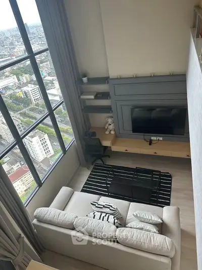 Stunning high-rise living room with panoramic city views and modern decor.