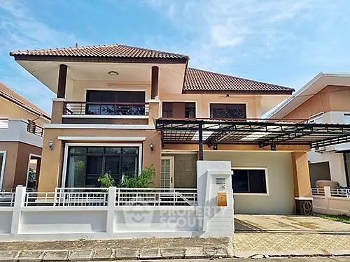 Charming two-story house with modern design and spacious driveway in a serene neighborhood.