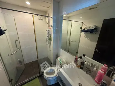 Modern bathroom with glass shower and sleek fixtures